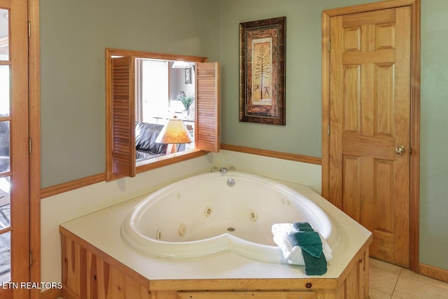 bathroom featuring tile patterned flooring and a jetted tub