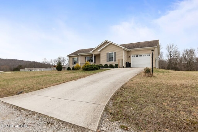 ranch-style home featuring a garage, central AC, a front lawn, and concrete driveway