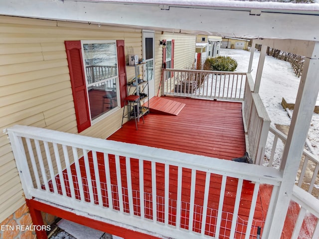 view of snow covered deck