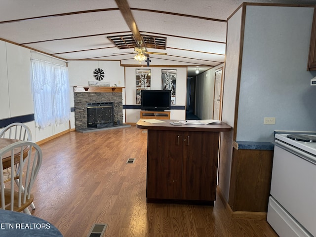 kitchen featuring dark brown cabinetry, visible vents, electric stove, open floor plan, and wood finished floors