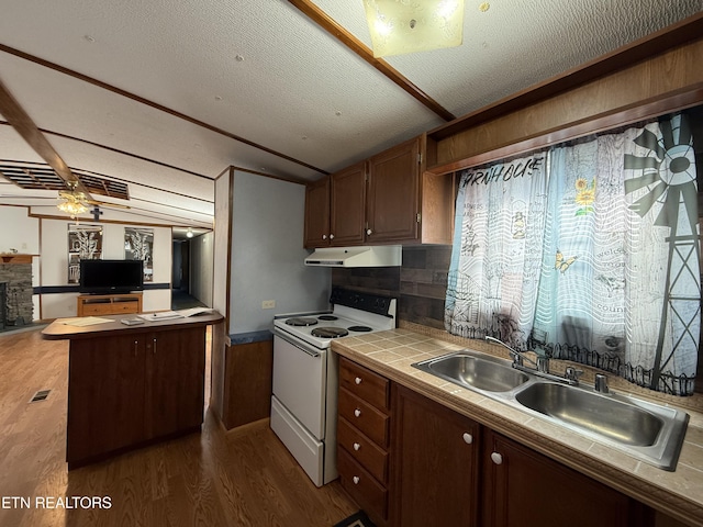 kitchen featuring dark wood-style floors, tile countertops, white electric range oven, a sink, and under cabinet range hood