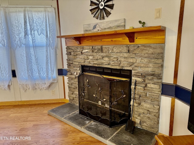 room details with a fireplace and wood finished floors