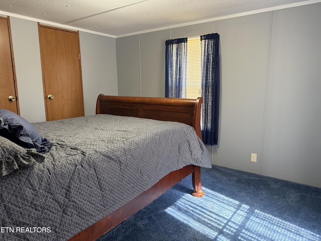 carpeted bedroom with a textured ceiling