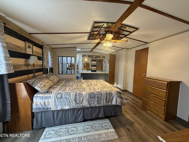 bedroom featuring lofted ceiling and dark wood-type flooring