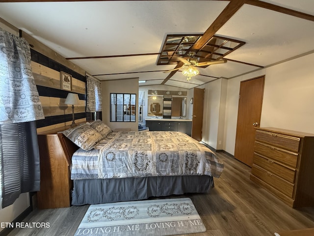 unfurnished bedroom with vaulted ceiling and wood finished floors