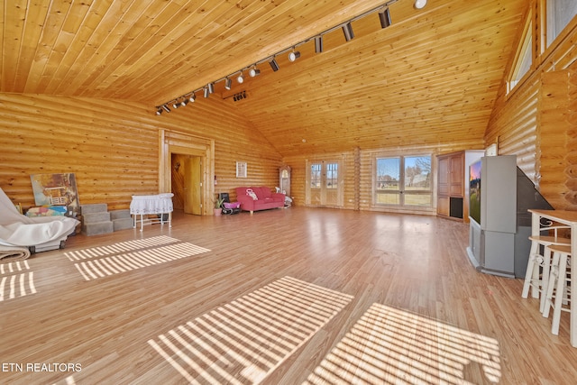 interior space with wood ceiling, log walls, light wood-type flooring, high vaulted ceiling, and track lighting