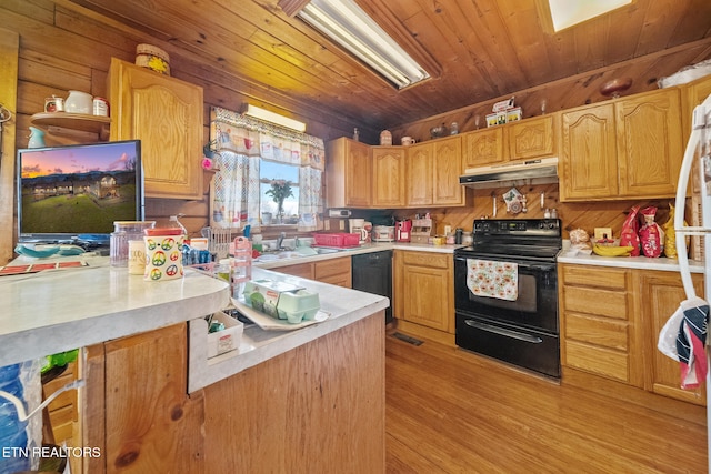 kitchen featuring lofted ceiling, light countertops, wood ceiling, under cabinet range hood, and black appliances