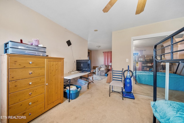 interior space featuring light carpet and ceiling fan