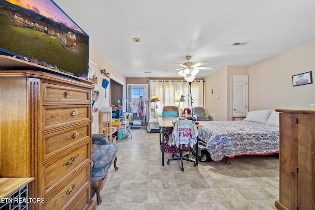 bedroom featuring a ceiling fan and visible vents