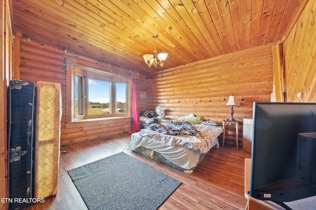 bedroom featuring wooden ceiling, wood finished floors, rustic walls, and an inviting chandelier