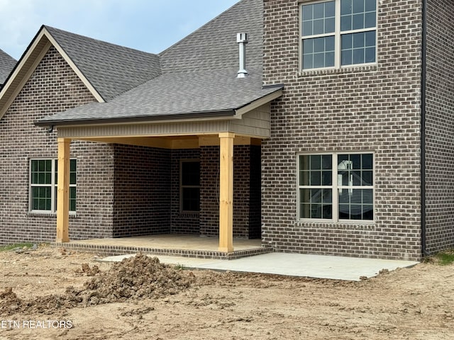 2127 Lantern Park Ln, Knoxville, TN 37932 - back of house featuring brick siding, a patio, and a shingled roof