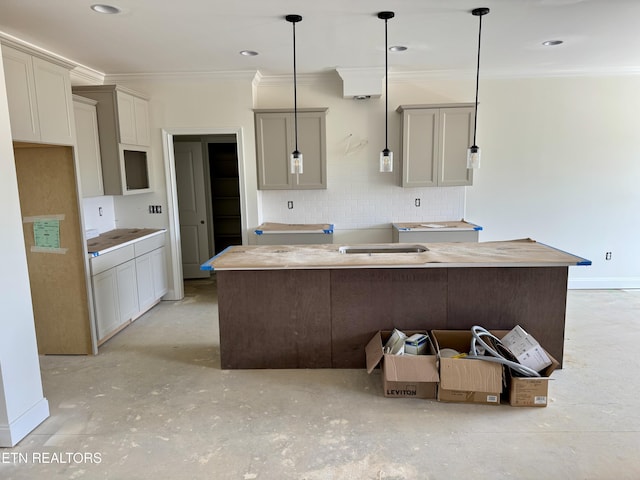 2127 Lantern Park Ln, Knoxville, TN 37932 - kitchen featuring a kitchen island, ornamental molding, backsplash, concrete flooring, and decorative light fixtures