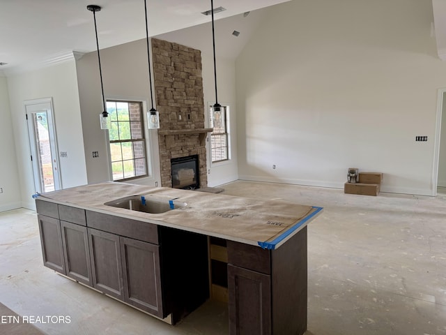 2127 Lantern Park Ln, Knoxville, TN 37932 - kitchen with a fireplace, open floor plan, high vaulted ceiling, dark brown cabinets, and a center island