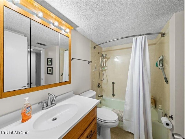 bathroom with toilet, a textured ceiling, vanity, and shower / bath combo with shower curtain