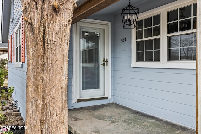 doorway to property with covered porch