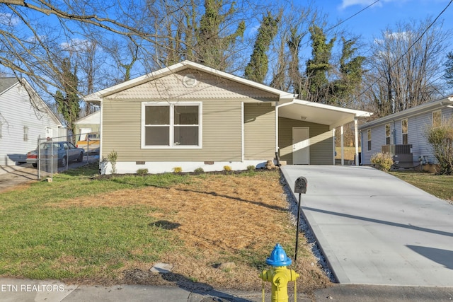 view of front of home with an attached carport, a front lawn, concrete driveway, central AC unit, and crawl space