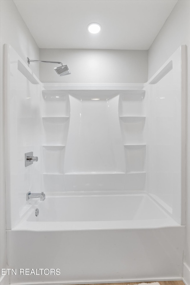 bathroom featuring visible vents and shower / bathtub combination