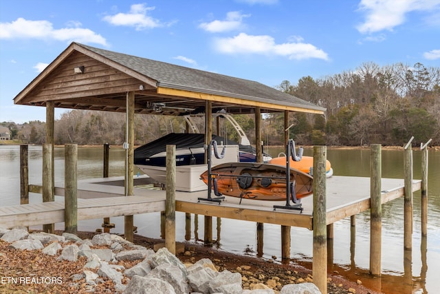 view of dock with a water view and boat lift