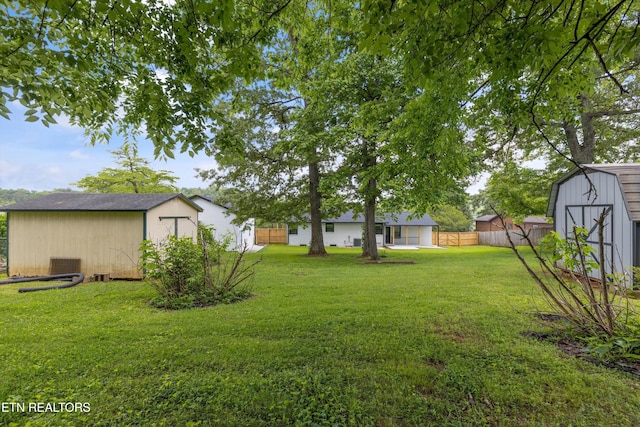 11433 Turkey Creek Rd, Knoxville, TN 37934 - view of yard featuring a storage unit, an outdoor structure, and cooling unit