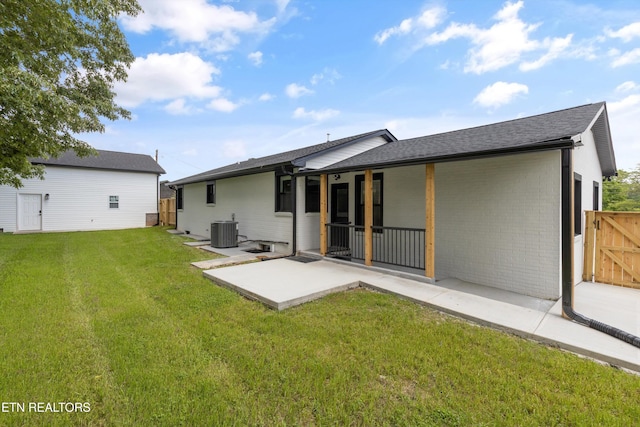 11433 Turkey Creek Rd, Knoxville, TN 37934 - back of property featuring cooling unit, a patio area, brick siding, and a shingled roof