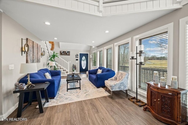 living room with stairs, baseboards, wood finished floors, and recessed lighting