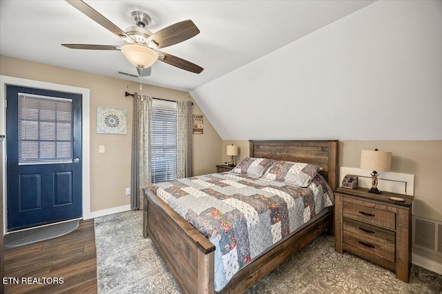 bedroom featuring baseboards, visible vents, dark wood finished floors, ceiling fan, and vaulted ceiling