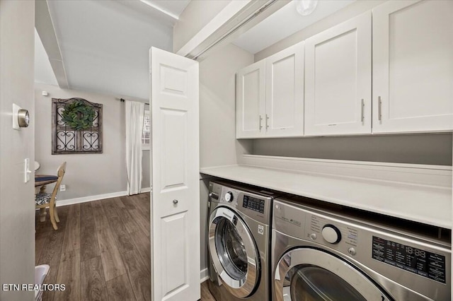 laundry room with washer and dryer, dark wood-style flooring, cabinet space, and baseboards