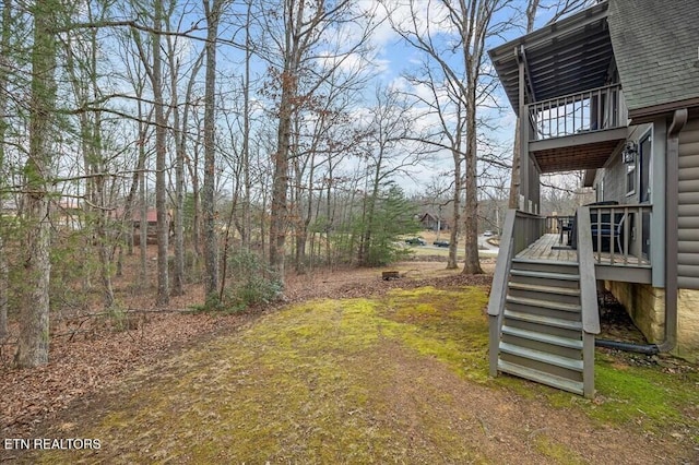 view of yard featuring stairway and a wooden deck