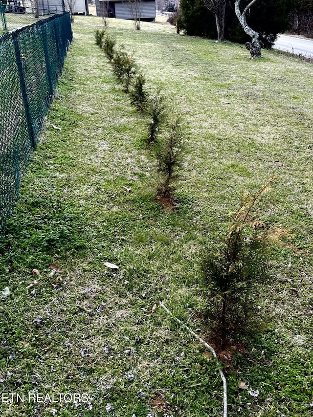 view of yard with fence