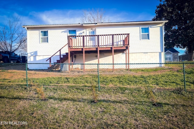 rear view of property featuring a deck, stairway, a yard, and a fenced backyard