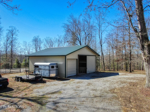 detached garage with fence