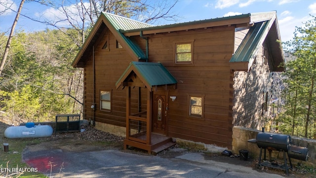 exterior space featuring metal roof