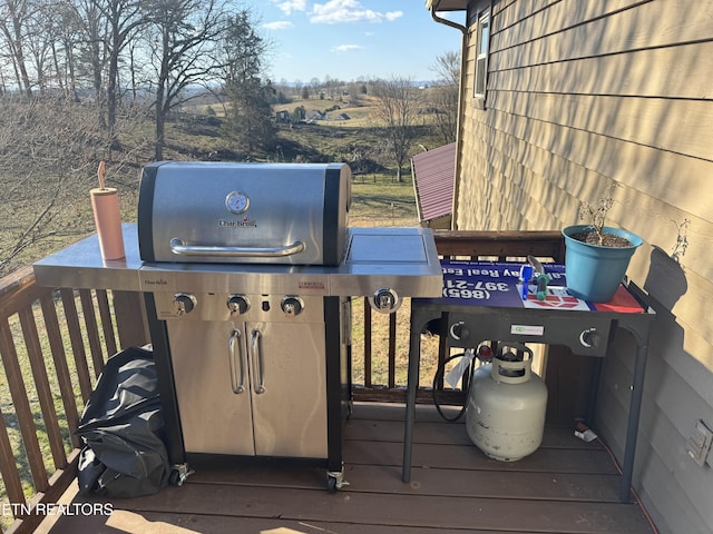 wooden deck featuring area for grilling