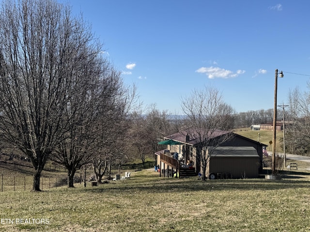 view of yard with a rural view