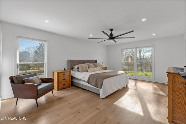 bedroom featuring light wood-type flooring, multiple windows, a ceiling fan, and recessed lighting