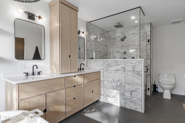 full bathroom featuring a stall shower, visible vents, a sink, and double vanity