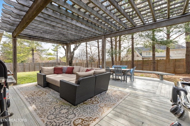 deck with outdoor dining space, outdoor lounge area, a fenced backyard, and a pergola