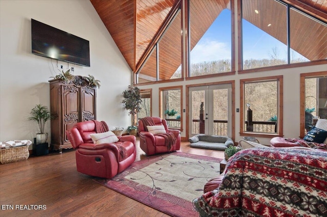 bedroom with wooden ceiling, wood finished floors, access to exterior, french doors, and high vaulted ceiling