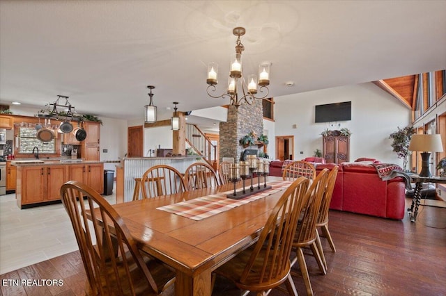 dining space featuring a notable chandelier and light wood-style flooring