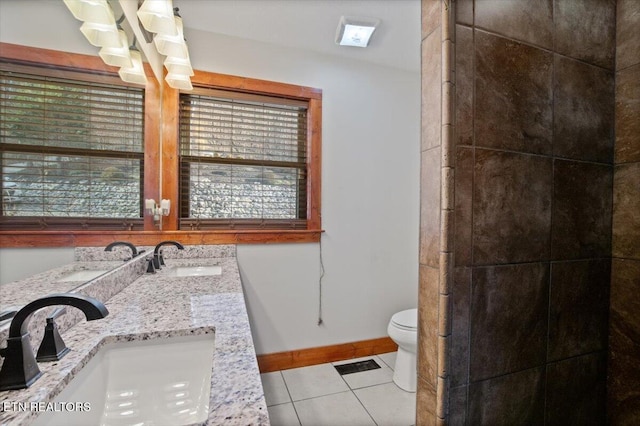 full bath with tile patterned flooring, visible vents, a sink, and toilet