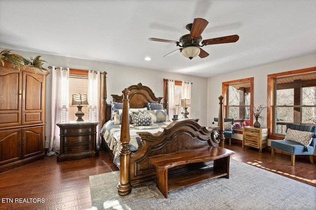 bedroom featuring ceiling fan and dark wood-type flooring