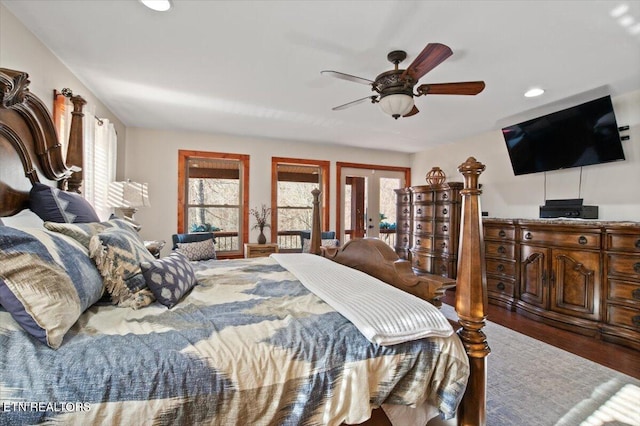 bedroom featuring recessed lighting, ceiling fan, wood finished floors, and french doors