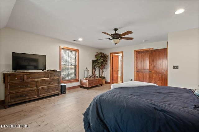 bedroom with light wood-style floors, recessed lighting, visible vents, and baseboards