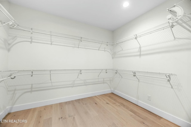 spacious closet with light wood finished floors