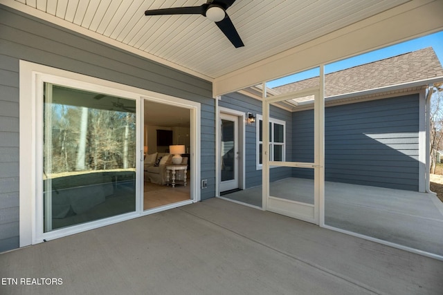 view of patio featuring ceiling fan
