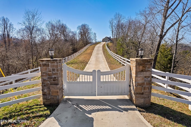 view of gate with fence