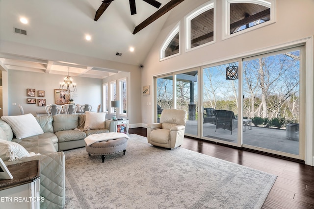 living area with visible vents, a chandelier, wood finished floors, high vaulted ceiling, and beam ceiling