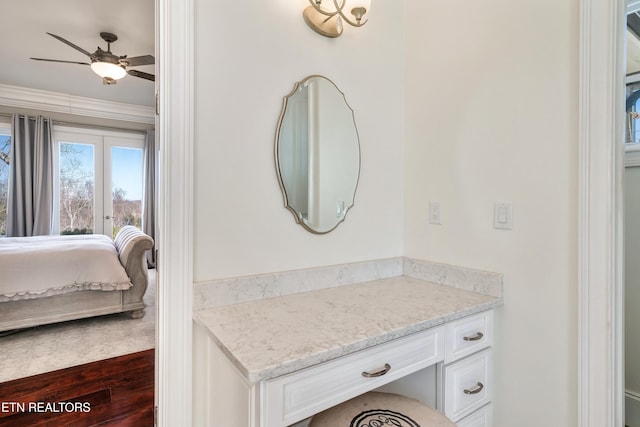 ensuite bathroom featuring connected bathroom, vanity, and ceiling fan