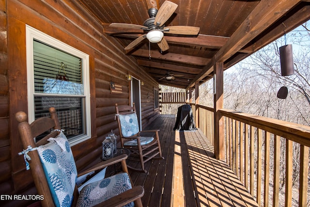 wooden terrace with a ceiling fan