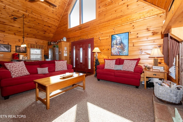 living room with wooden ceiling, wood walls, carpet flooring, and lofted ceiling